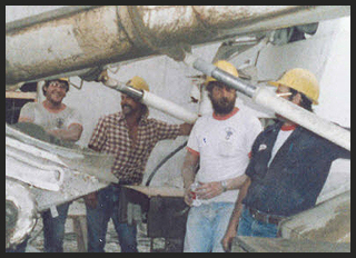 Croell employees standing next to cement truck.